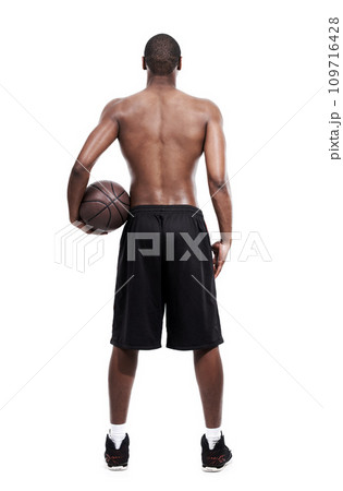 Man, basketball player and standing for training, back and shirtless on white background, confident and game. Studio backdrop, fit and sportsman for exercise, health and african active athlete 109716428