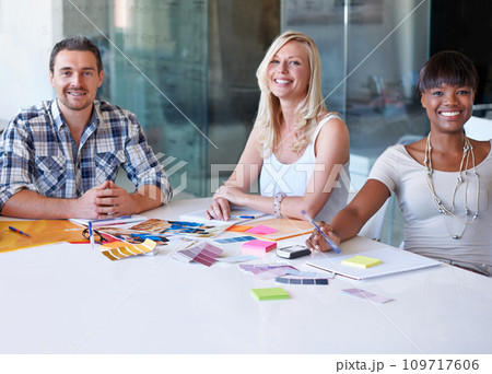 Portrait, smile and group of business people at table in meeting together, cooperation or collaboration in startup. Happy face, creative team or designers at desk, diversity or brainstorming strategy 109717606
