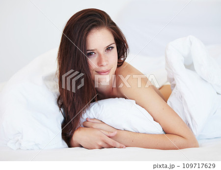 Woman, bed and portrait in morning with smile, relax and holiday with calm in apartment, hotel or home. Girl, person and lying in bedroom, house and wake up with cover, duvet or blanket on vacation Woman, bed and portrait in morning with smile, relax and holiday with calm in apartment, hotel or home. Girl, person and lying in bedroom, house and wake up with cover, duvet or blanket on vacation 109717629