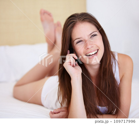 Phone call, thinking and laughing with a woman in the bedroom of her home for communication or conversation. Smile, contact or funny with a happy young person chatting on her mobile and lying in bed Phone call, thinking and laughing with a woman in the bedroom of her home for communication or conversation. Smile, contact or funny with a happy young person chatting on her mobile and lying in bed 109717996