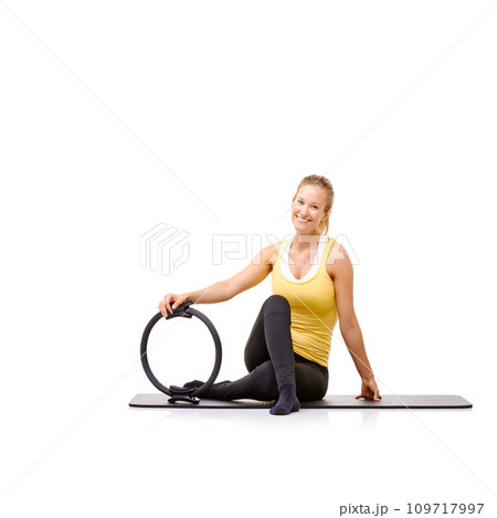 Pilates ring, fitness and portrait of woman in studio isolated on a white background mockup space. Smile, person on mat and magic circle for training, exercise sport and healthy body workout on floor 109717997