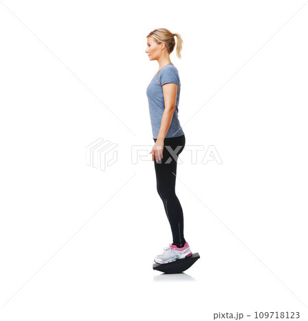Balance board, fitness and woman with exercise, wellness and girl isolated on a white studio background. Profile, person and model with equipment, mockup space and healthy with training and workout 109718123