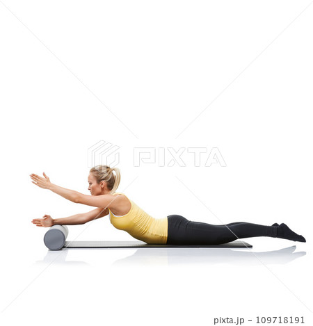 Pilates, foam roller and woman in floor exercise, stretching or gym routine for sports wellness, fitness or physical training. Stability, mockup studio space or profile of athlete on white background 109718191