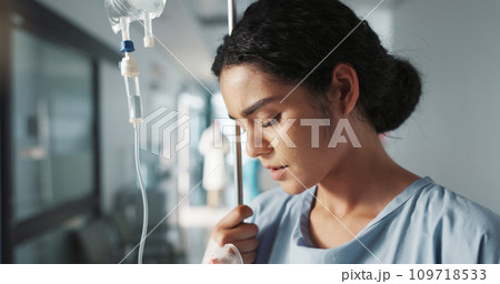Sad, breathing and a woman with an iv drip at hospital for medicine, wellness and recovery from virus. Depression, thinking and a clinic patient with treatment stress, burnout or anxiety while sick 109718533