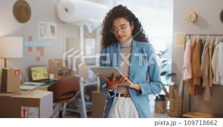 Woman, fashion designer and tablet in logistics, research or small business management at boutique. Female person or entrepreneur working on technology for inventory or storage check at retail store Woman, fashion designer and tablet in logistics, research or small business management at boutique. Female person or entrepreneur working on technology for inventory or storage check at retail store 109718662