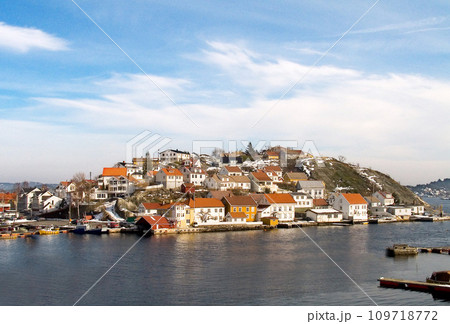 Island, water and houses at ocean in Norway, Europe and tourism, travel or vacation. Exterior, home and Scandinavian buildings at sea, vintage architecture or traditional property with boats at port Island, water and houses at ocean in Norway, Europe and tourism, travel or vacation. Exterior, home and Scandinavian buildings at sea, vintage architecture or traditional property with boats at port 109718772