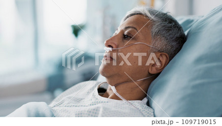 Sick, iv drip and senior woman in the hospital for consultation, surgery or treatment. Healthcare, recovery and elderly female patient resting in bed after operation or procedure in a medical clinic. 109719015