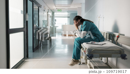 Fail, crying or doctor with stress in hospital unhappy with healthcare results or medical problem. Depression, mistake or sad woman nurse frustrated by grief, death or loss in clinic with headache 109719017