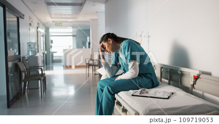 Stress, sad and loss with a woman nurse in hospital after a fail, mistake or error in healthcare treatment. Depression, anxiety and grief with a young medicine professional in a medical clinic 109719053