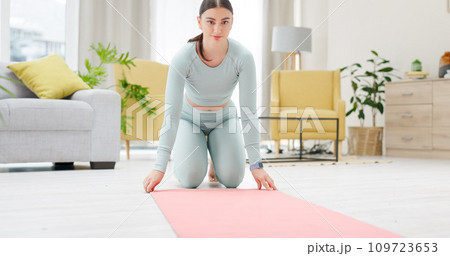 Woman, floor and yoga mat for start in home with thinking, ideas and ready for fitness in living room. Girl, training and exercise with health, workout and wellness in lounge with vision in house 109723653