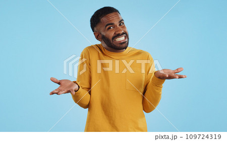 Confused, hands and face of man in studio with dont know, gesture or ask on blue background. Why, portrait and guy model with oops, mistake or doubt, unsure or forget, guess or palm scale questions 109724319