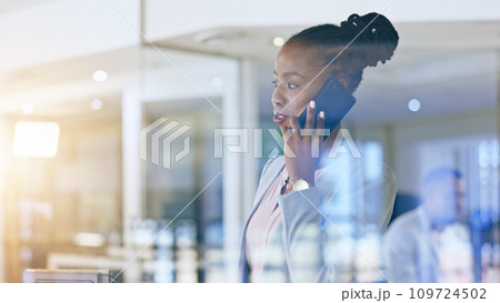 Business woman, phone call and thinking by window in communication, human resources networking and decision. African worker talking on mobile with reflection, ideas and solution for company employees 109724502