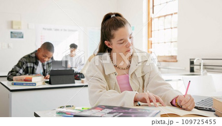 Classroom, student and girl writing, education and notebook with knowledge, development or studying. Group, academic or person with creativity, lesson or learning with assessment, thinking or academy 109725455