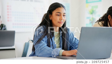 Woman, student and laptop for classroom education, e learning and studying or research in college. Young people typing on computer for university or school information, FAQ or scholarship application 109725457