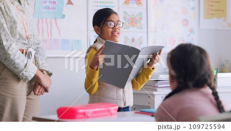 Child, reading and classroom with girl speaker, book and education at a school. Students, learning and notebook with development, knowledge and study work with story discussion of youth assessment Child, reading and classroom with girl speaker, book and education at a school. Students, learning and notebook with development, knowledge and study work with story discussion of youth assessment 109725594