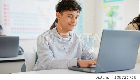 Man, student and laptop for school, elearning and studying or research in college or class. Teenager typing on computer for planning, classroom information and scholarship application or online FAQ 109725759