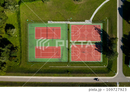 View from the height of the empty Tennis courts in the daytime in summer View from the height of the empty Tennis courts in the daytime in summer 109727923