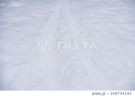 Winter road with snow close up background 109734191
