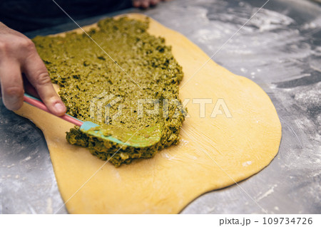 Baker make stuffed sweet bread 109734726