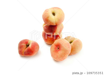Several saturn peaches or flat peaches isolated on white background with clipping path.. Several saturn peaches or flat peaches isolated on white background with clipping path.. 109735351
