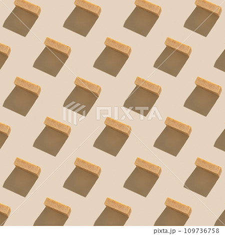 Pattern with Natural beige soap bars on light beige top view, hard shadows 109736758