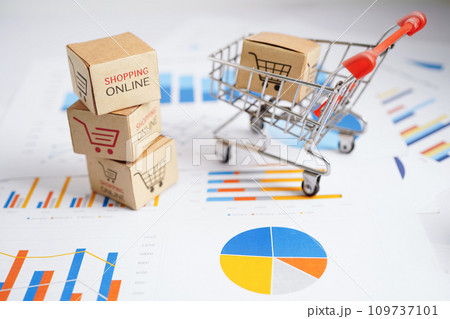 Online shopping, Shopping cart box on business graph, import export, finance commerce. Online shopping, Shopping cart box on business graph, import export, finance commerce. 109737101