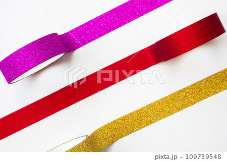 colorful glitter tape rolls strips on white background 109739548