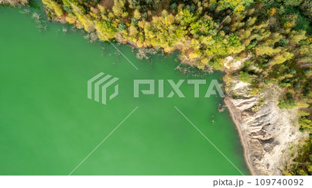 Aerial View of a Verdant River Bend with Rocky Embankment Aerial View of a Verdant River Bend with Rocky Embankment 109740092