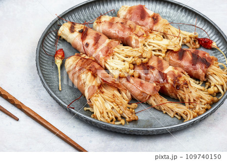 Grilled enoki mushroom with bacon Grilled enoki mushroom with bacon 109740150