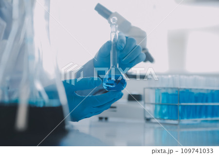 biochemical research scientist team working with microscope for coronavirus vaccine development in pharmaceutical research labolatory, selective focus biochemical research scientist team working with microscope for coronavirus vaccine development in pharmaceutical research labolatory, selective focus 109741033