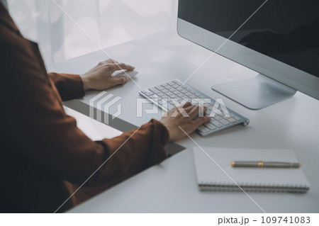 Beautiful female call center operator working on computer in office 109741083