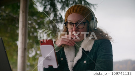 Adult woman remotely talk with employees in gazebo 109741132