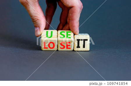 You use or lose it symbol. Concept word Use It or lose it on wooden cubes. Beautiful grey table grey background. Businessman hand. Business and you use or lose it concept. Copy space. You use or lose it symbol. Concept word Use It or lose it on wooden cubes. Beautiful grey table grey background. Businessman hand. Business and you use or lose it concept. Copy space. 109741854