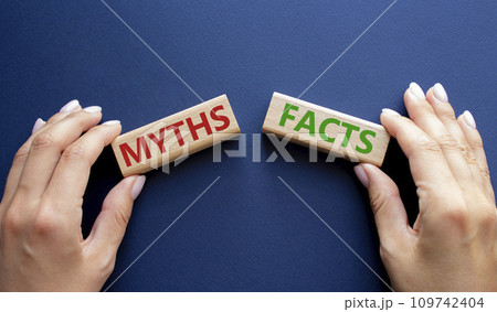 Facts or Myths symbol. Concept word Facts or Myths on wooden blocks. Businessman hand. Beautiful deep blue background. Business and Facts or Myths concept. Copy space Facts or Myths symbol. Concept word Facts or Myths on wooden blocks. Businessman hand. Beautiful deep blue background. Business and Facts or Myths concept. Copy space 109742404
