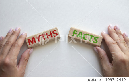 Facts or Myths symbol. Concept word Facts or Myths on wooden blocks. Businessman hand. Beautiful white background. Business and Facts or Myths concept. Copy space 109742419