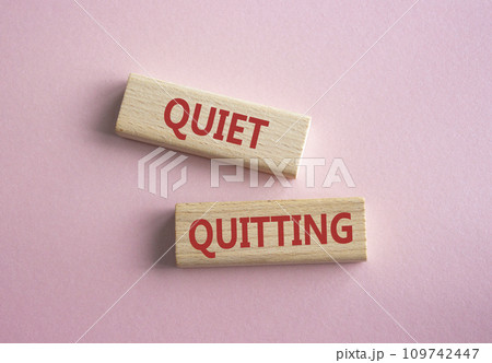 Quiet quitting symbol. Concept word Quiet quitting on wooden blocks. Beautiful pink background. Business and Quiet quitting concept. Copy space. 109742447