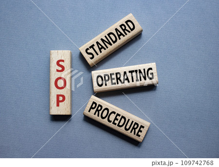 SOP - Standard Operating Procedure symbol. Wooden blocks with word SLA. Beautiful grey background. Business and Service Level Agreement concept. Copy space. SOP - Standard Operating Procedure symbol. Wooden blocks with word SLA. Beautiful grey background. Business and Service Level Agreement concept. Copy space. 109742768