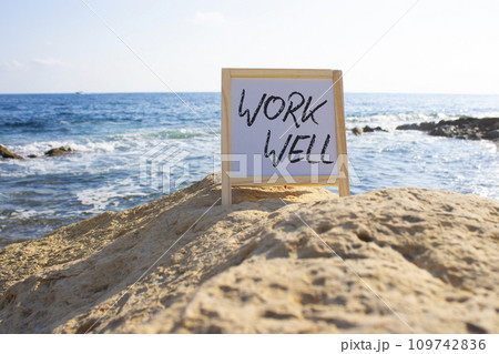 Work Well symbol. Concept words Work well on white chalk background. Beautiful sea background. Business and Work Well concept. Copy space 109742836
