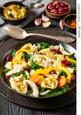 chicken minestrone soup with tortelloni in bowl 109742891