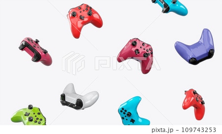 Realistic video game joysticks or gamepads rotating and falling on white 109743253