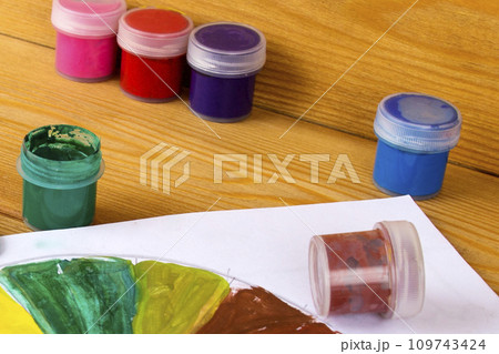 children's creativity. Drawing paints. 12 colors of paint. Color palette. Paints on a wooden background. Watercolor paints. artist's workshop. children's creativity. Drawing paints. 12 colors of paint. Color palette. Paints on a wooden background. Watercolor paints. artist's workshop. 109743424