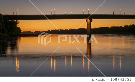 silhouette of the bridge over Missouri River at Hermann, MO, after sunset 109743553
