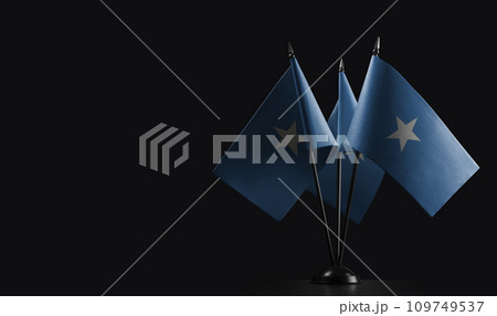 Small national flags of the Somalia on a black background Small national flags of the Somalia on a black background 109749537