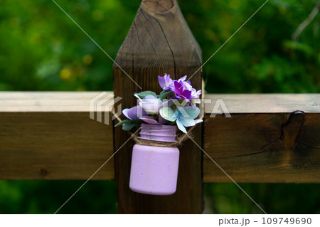 Bouquet of spring flowers in white and purple in watering can Bouquet of spring flowers in white and purple in watering can 109749690