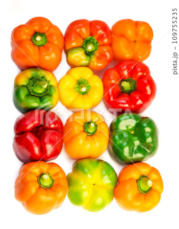 Set of colorful bell pepper isolated on white background top view. Raw red, yellow and green bell pepper. Set of colorful bell pepper isolated on white background top view. Raw red, yellow and green bell pepper. 109755235