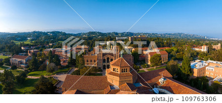 Aerial view of UCLA campus in Westwood, Los Angeles, featuring red-brick, Gothic, and modern buildings amidst green lawns and trees on a sunny day. Aerial view of UCLA campus in Westwood, Los Angeles, featuring red-brick, Gothic, and modern buildings amidst green lawns and trees on a sunny day. 109763306
