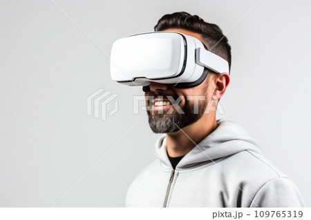 Caucasian brunette man with beard in virtual reality glasses on white background. Copy space. Banner template of man in VR goggles. Concept of technology, game, entertainment, artificial intelligence. 109765319