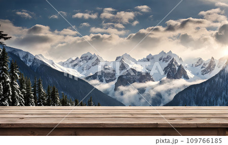 Winter serenity: Empty wooden table with snowy mountain backdrop 109766185