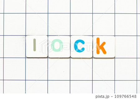 Colorful tile letter in word lock on white grid background Colorful tile letter in word lock on white grid background 109766548