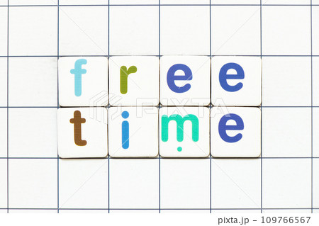 Colorful tile letter in word free time on white grid background 109766567